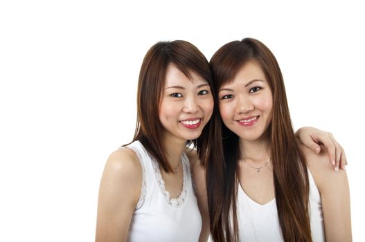 Two cheerful Asian girls isolated on white background.