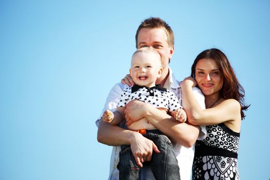 happy family blue sky on background