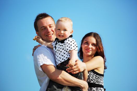 happy family blue sky on background