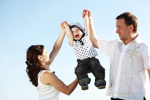 happy family blue sky on background