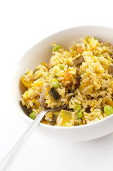 Bowl of pumpkin fried rice on white background