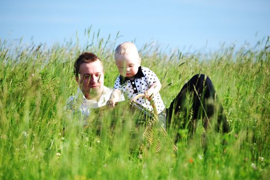  happy family on picnic in green grass