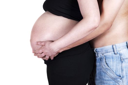 Mom and Dad with hands on the baby