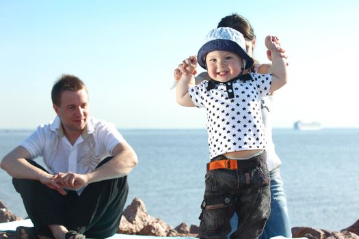 happy family on picnic sea on background