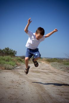 happy jumping child in summer