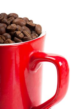 A red cup with coffee beans isolated over white background