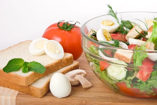 Fresh raw vegetable salad in glass bowl