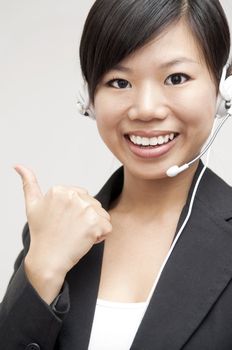 Thumb up Friendly Customer Representative with headset