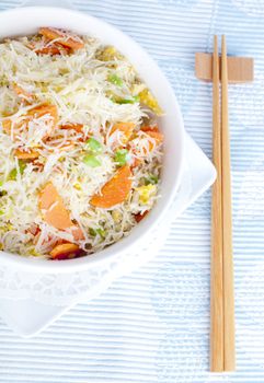 Asian fried rice noodles. Serve with chopsticks.