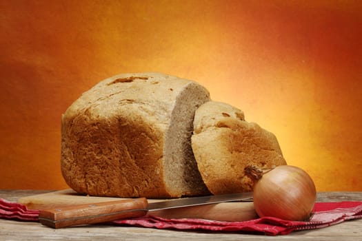 Close up of sliced homemade bread and  onion 