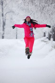 woman run in winter park very happy