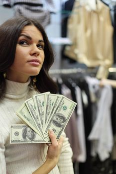 woman in shop look at clothes