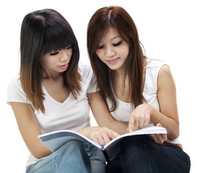 Asian students sitting learning together on white background