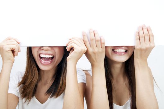 Concept photo of Asian women holding a white card, covering eyes.