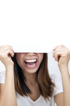 Concept photo of Asian woman holding a white card, covering her eyes.