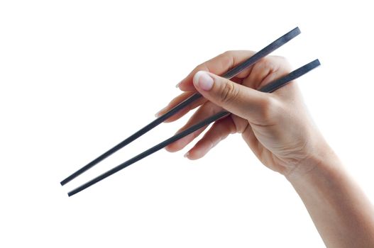 Hand holding a pair of chopsticks, isolated on white background.