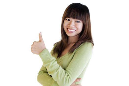 Young Asian female giving thumbs up sign.