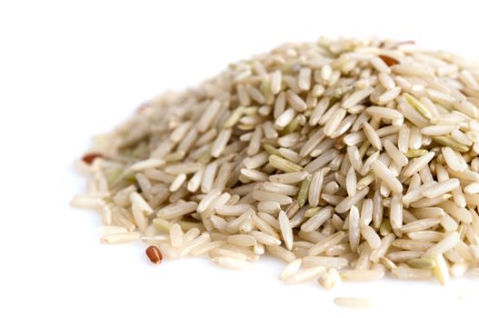 Pile of brown rice isolated on white background