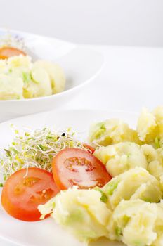 Fresh vegetarian potato salad with vegetables.