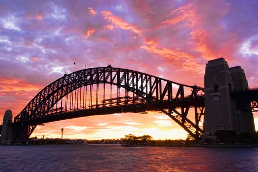 Sydney Harbour Bridge At Dusk with firing sky in background