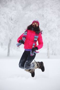 winter women jump in snow