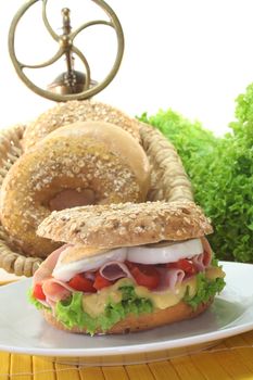 Rye bagel with lettuce, ham and egg