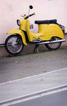 old yellow scooter in retro look design