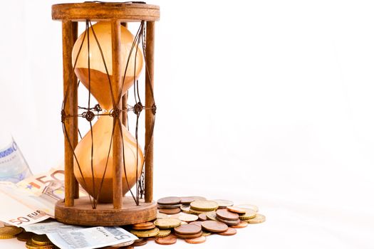Old hourglass (made in India, XIX century) with euros