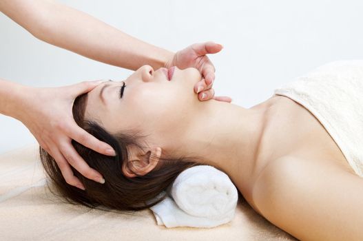 Beauty and Spa - Young Girl having a massage on her face