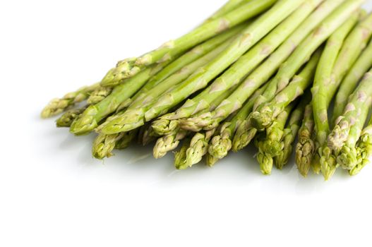 Bundle of fresh asparagus on white background