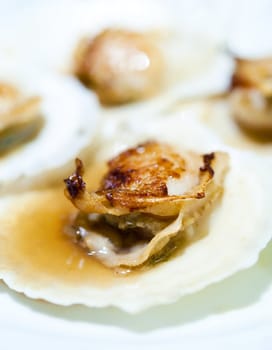 Close up on Japanese food, baked scallop.