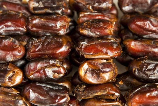 Delicious medjool dates in row.