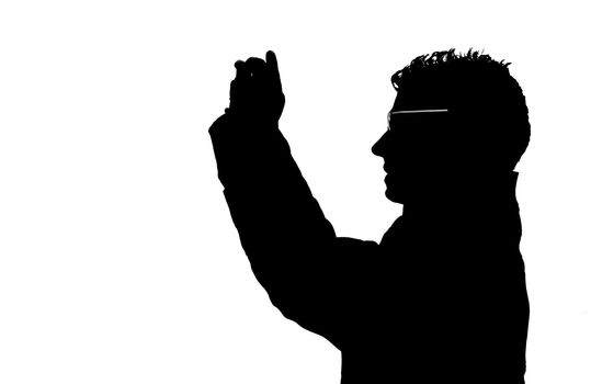 Silhouette of a guy taking pictures with a cell (mobile) phone or point and shoot (compact) camera