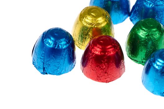 Colorful chocolates isolated on a white background.