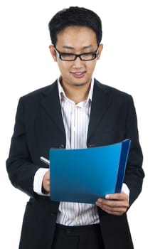 Portrait of an Asian executive writing and smiling