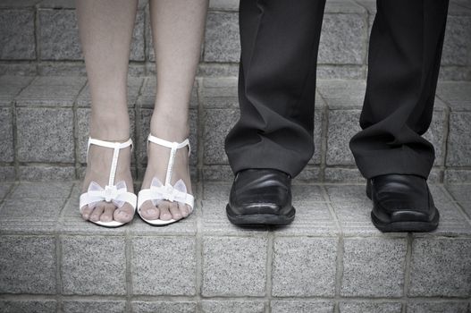 Bride and Groom standing on stairs