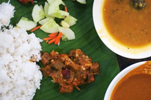 Delicious Indian cuisine spicy banana leaf rice