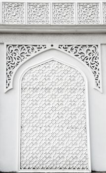 An example of Islamic mosque design cast in concrete on a building in Terengganu, Malaysia.