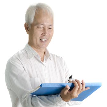 Asian senior businessman writing on document