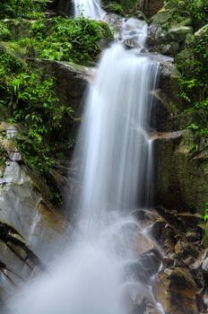 Natural waterfall at tropical rainforest Malaysia in a morning.