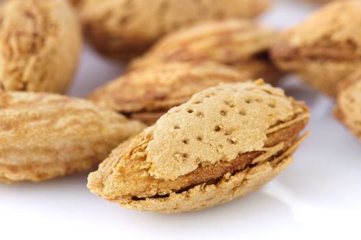 Closeup view of roasted almonds in shell