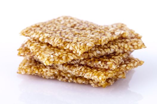 Sweet sesame snack on white background.