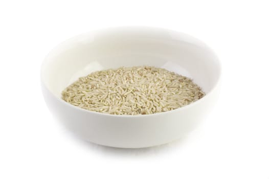 A bowl of uncooked brown rice. 
