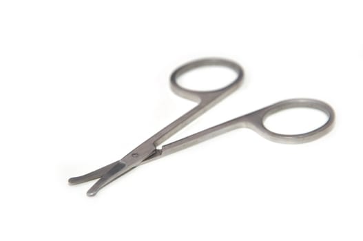 Stainless steel scissors on isolated white background