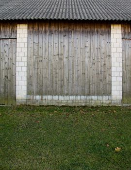 detail of barn made of wood and white stone