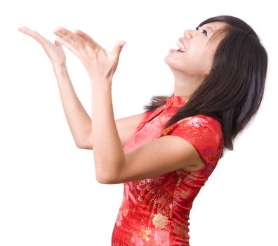 Happy oriental girl open her arms looking up with surprising face 