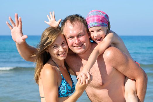 Father, Mother and Daughter on the beach