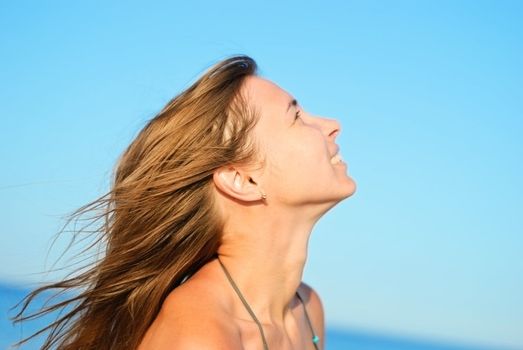 Young beautiful woman on a beach