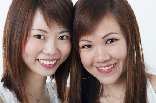 Close up cheerful Asian girls on white background