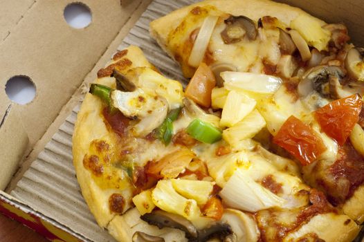 Fresh hot vegetarian pizza delivery in box.